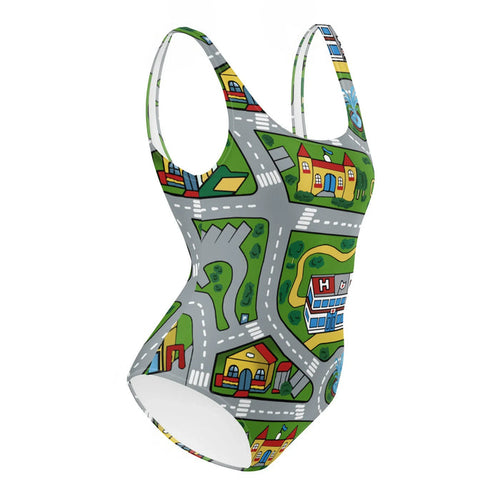 This swimsuit transforms into a nostalgic children's playroom rug, featuring a bird's-eye town map with winding gray asphalt roads, white lane dividers, and vibrant lawn-green spaces. Contact us with accessibility feedback, we'd love to help!