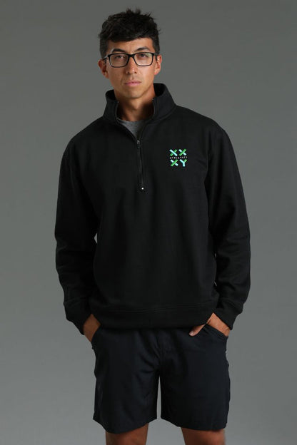 Person wearing a black pullover with a logo on a gray background || Black