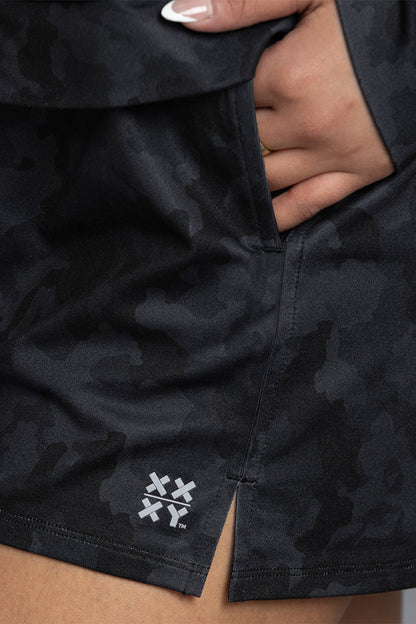 Black camouflage shorts with a brand logo on a neutral background || Black Camo
