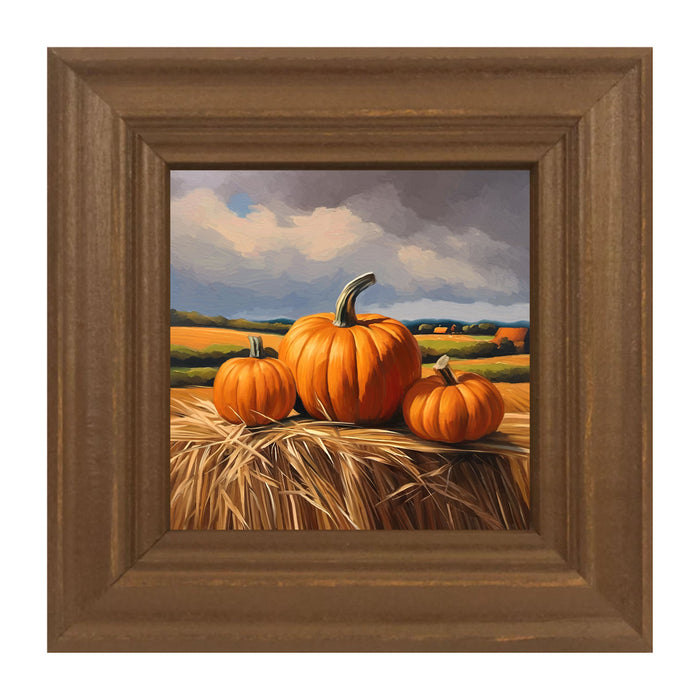 Trio of pumpkins on Hay